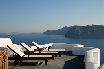 Sunlounger at the terrace in Santorini, Greece