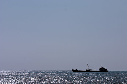 cargo ship on a background of horizon