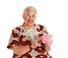 Retired woman holkding piggy bank