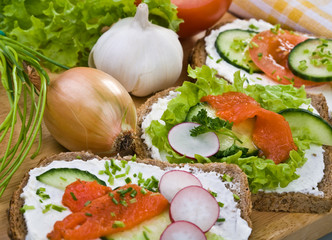 Whole grain bread, vegetables ,white cheese and salmon