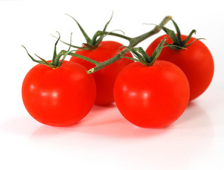 Fresh ripe red tomatoes on white background