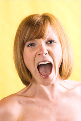 unhappy woman is looking angrily and is screaming