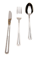 Knife, fork and spoon isolated on white