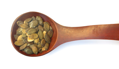 Pumpkin seeds roasted salted in wooden spoon