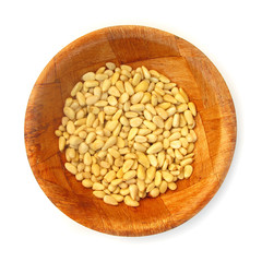 Pine nuts edible seeds in wooden dish