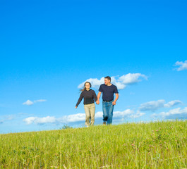 people running to a meadow