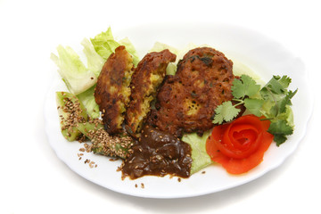 onion bhagees, tamarind sauce and green tomatoes with roasted se