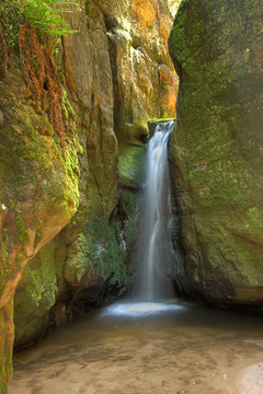 Waterfall in Aderspach sandstone rock city in Czech Republic