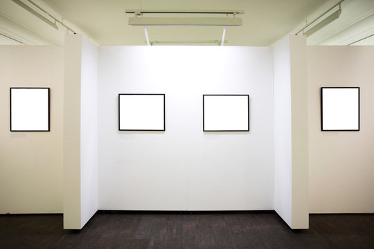 wall in museum with frames