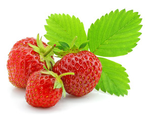 red strawberry fruits with green leafs isolated
