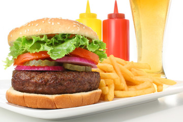 Hamburger meal with french fries and cold beer