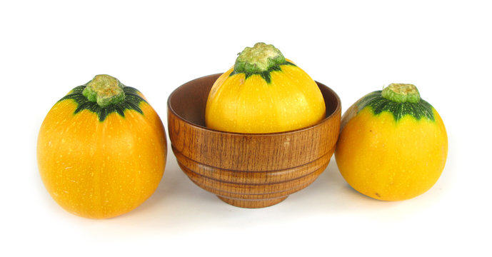 Pumpkin marrow vegetable squash with wooden dish