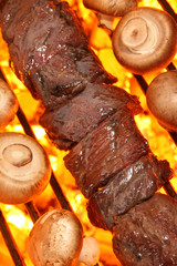 Beef shish kebabs and grilled mushrooms