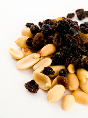 Stack Pile of Peanuts and Raisins on White Background