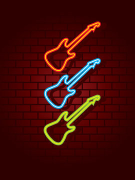 Neon guitars on brick wall