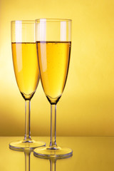 Champagne over yellow background