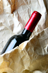 Red wine and crumpled paper-bag