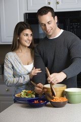 Couple in kitchen.