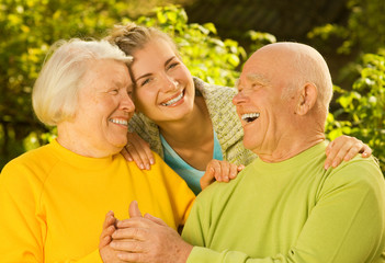 Grandparents with granddaughter outdoors