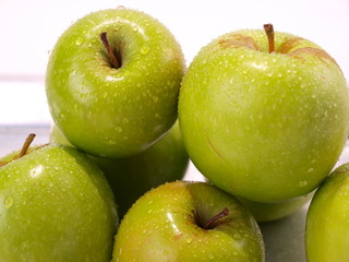 Fresh Green Apples Stacked on Steel Oven Tray Closeup