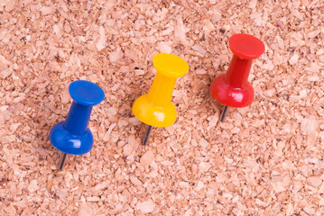 Color Thumbtacks on a Cork Background