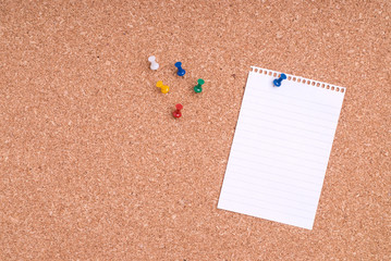 Note Paper With Tacks On Cork Surface
