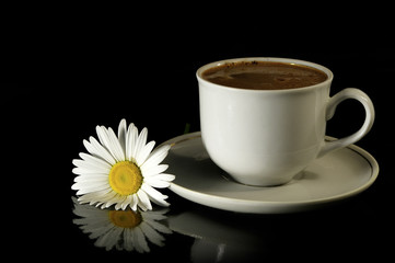 Cup of coffee on a black background