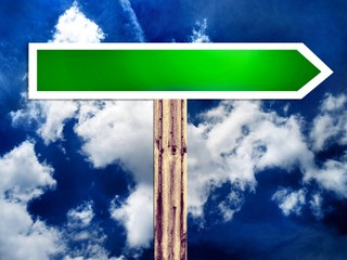 Blank green direction road street sign and the sky