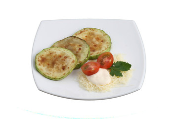 Roasted zucchini with tomatoes and cheese