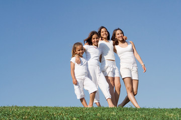 group of happy children walking in summer