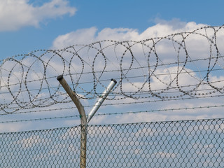 security fence with barbed wire