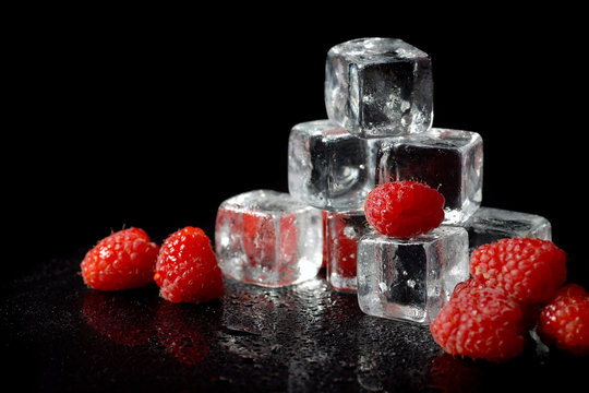 Ice cubes with raspberries