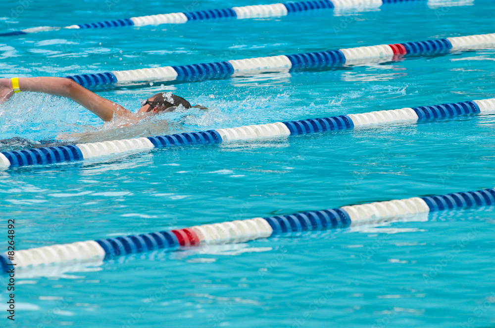 Wall mural non-identifiable swimmer in outdoor swimming pool