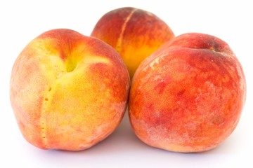 Three ripe peaches