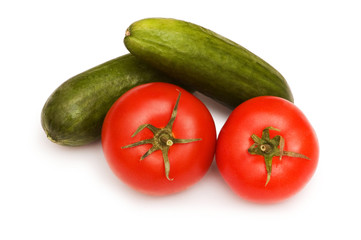 Tomatoes and cucumbers isolated on the white