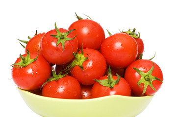 Wet whole tomatos arranged isolated on white