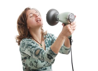 Woman singing with hairdryer