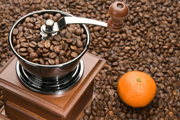 Old coffee grinder and Orange