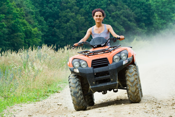 Fototapeta premium Woman riding ATV