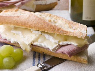 Brie and Ham Baguette with White Wine and Grapes