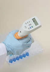 Hand holding pipette