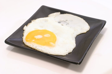 fried egg on black dish