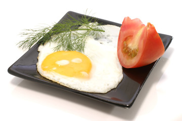 fried egg with tomato and fennel