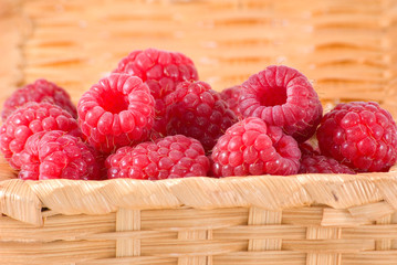 Bast-basket with a raspberry