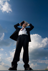 Businessman and laptop outside