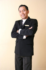 man in hotel or restaurant uniform