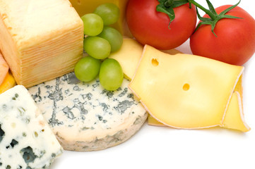 cheeses and vegetables on white background