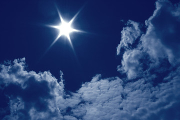 Sky with sun and clouds