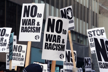 Muslim Protest And Protestors With Picket Signs stop racism