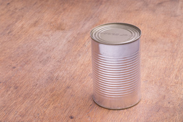 Closed Food Can on a Wooden Table